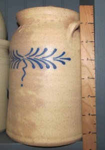 This crock is good for a large amount of pickles. It can take a quart of homemade easily, or one of the larger grocery store jars. It is a 'vintage' GCV piece. 